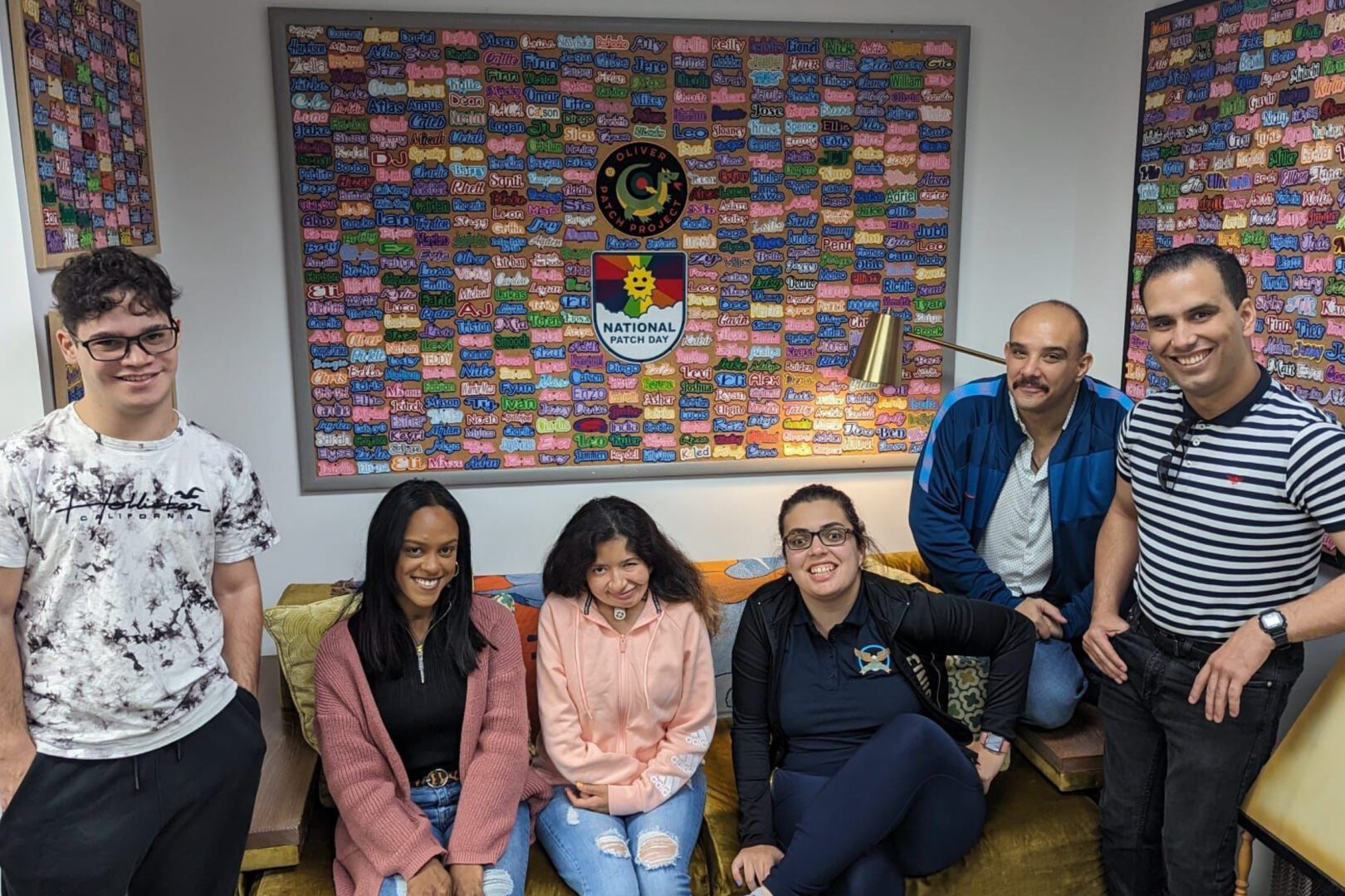 A group of people sitting on top of a couch.