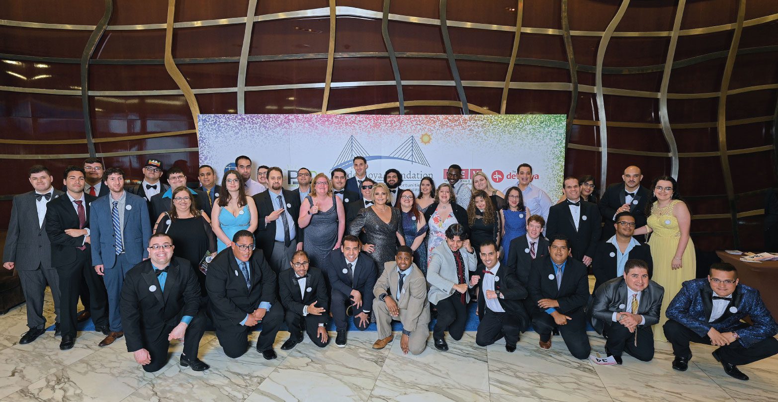 A group of people in suits and ties posing for a picture.