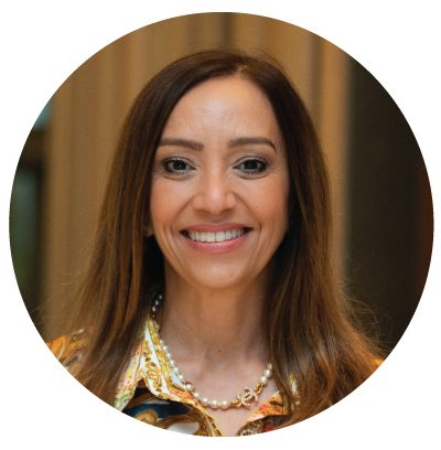 Smiling woman with long brown hair.