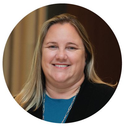 Smiling woman with long blonde hair.